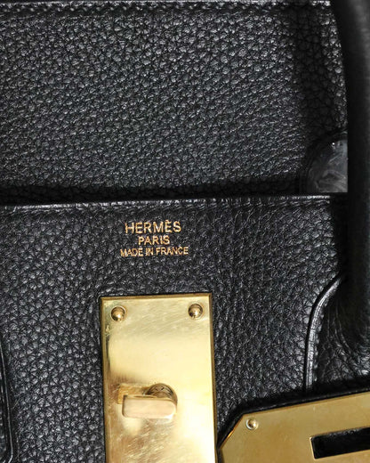 Close-up of Hermès Togo leather grain in black with gold hardware